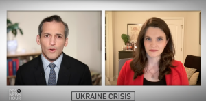Split screen. Male interviewer on left, female interviewee on right. PBS Newshour logo in left bottom conter. Cyron reads: Ukraine Crisis